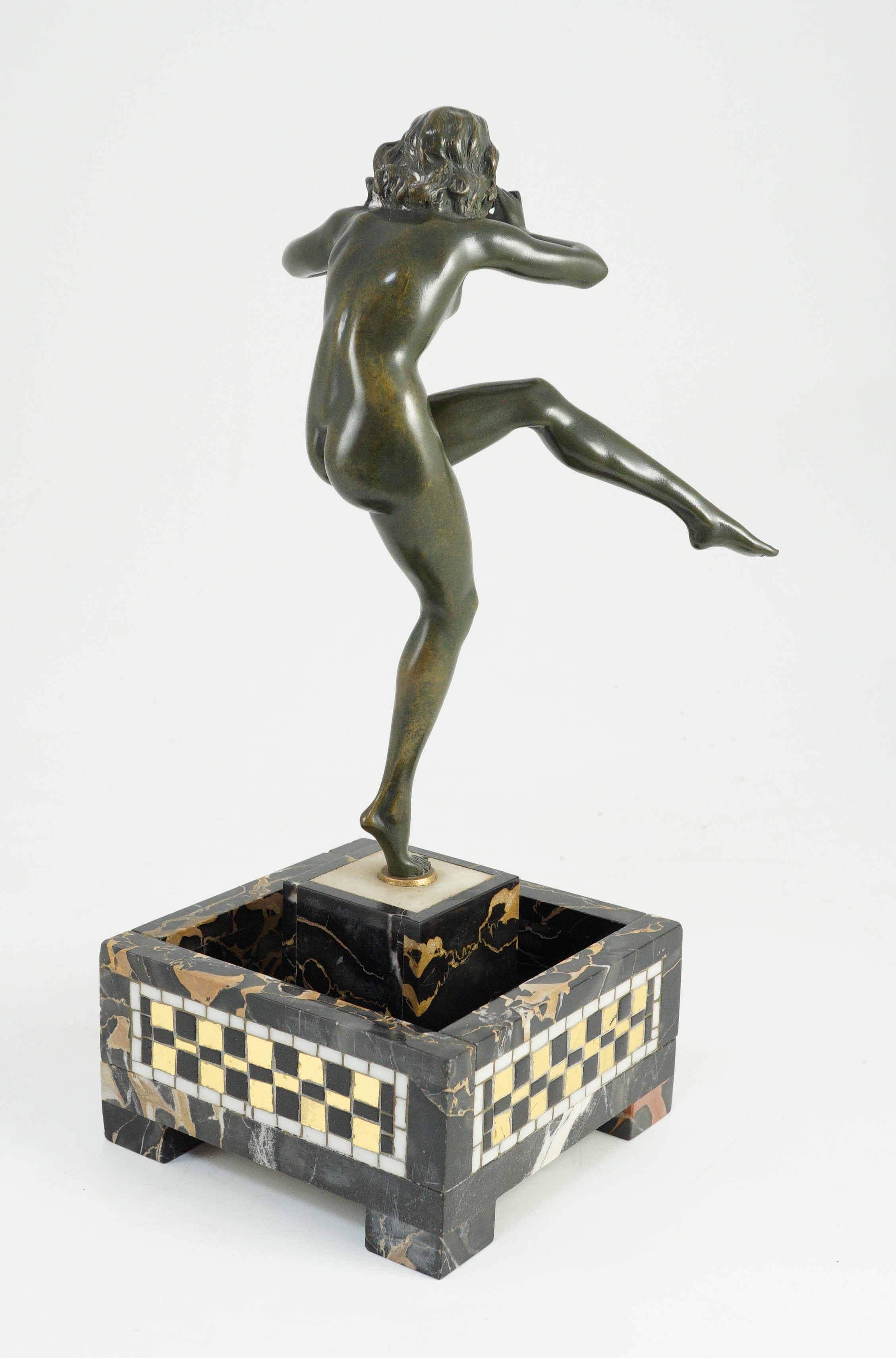 Pierre Le Faguays (1892-1962). An Art Deco bronze figure of a female pan piper, 15cm wide 37cm high overall